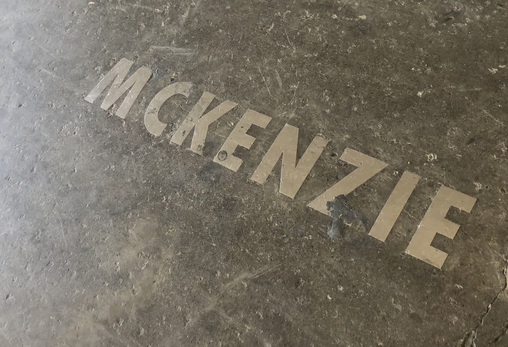 McKenzie in the concrete by a park feature. 