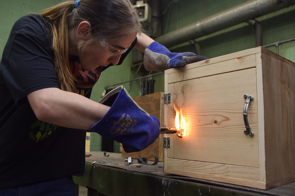 Students in shop classes learned about the torch by making sheet metal "brands" to mark their custom built "cubbys'. 